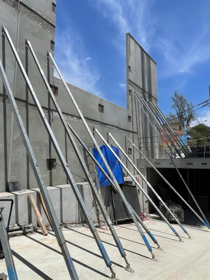 Precast panel installation and temporary bracing on site